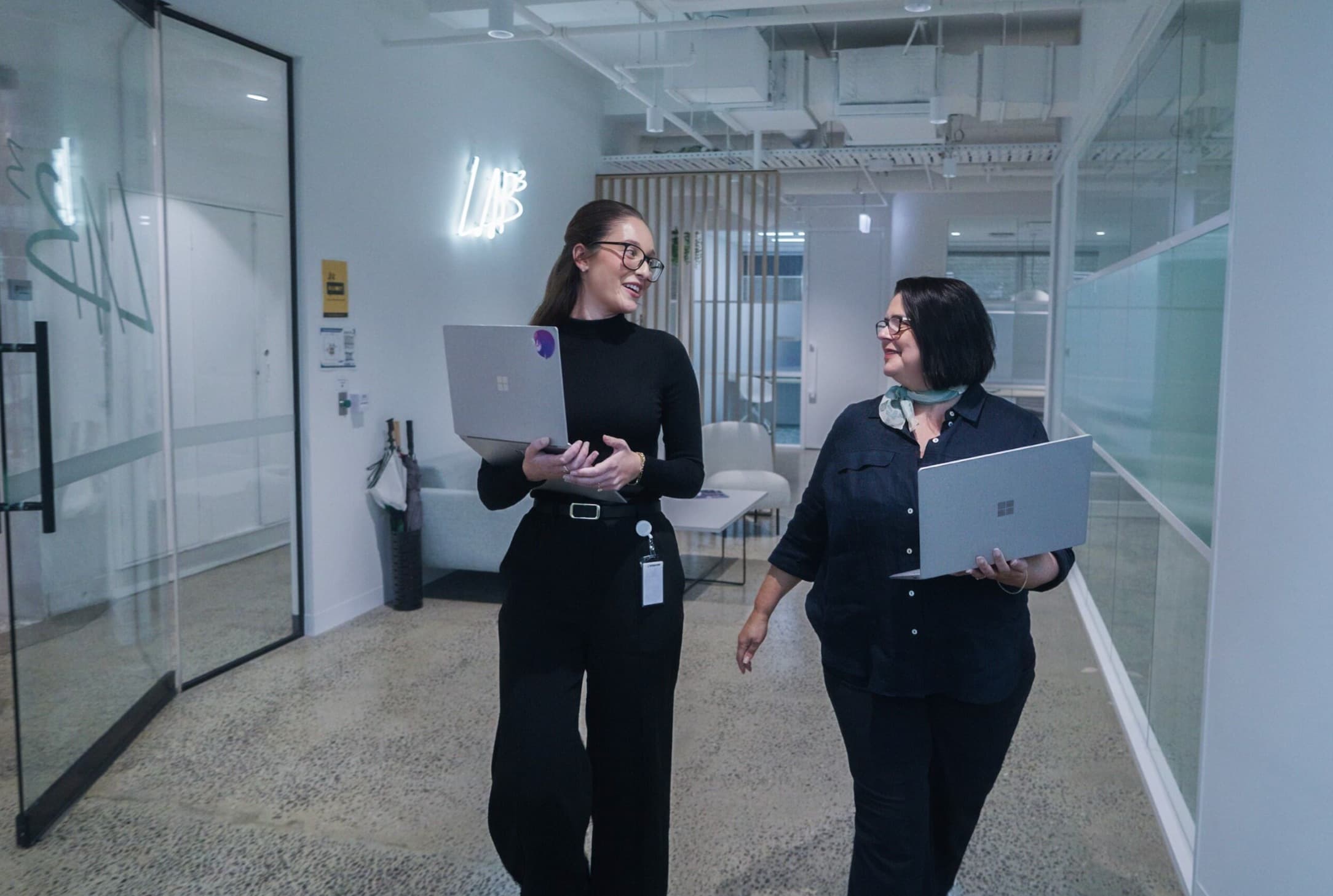 LAB3 team members working together in a collaborative technology consulting environment in Melbourne, Australia.
