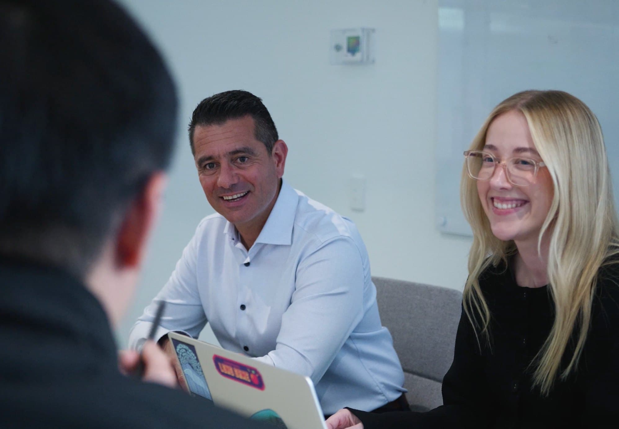 LAB3 team members smiling during a meeting.
